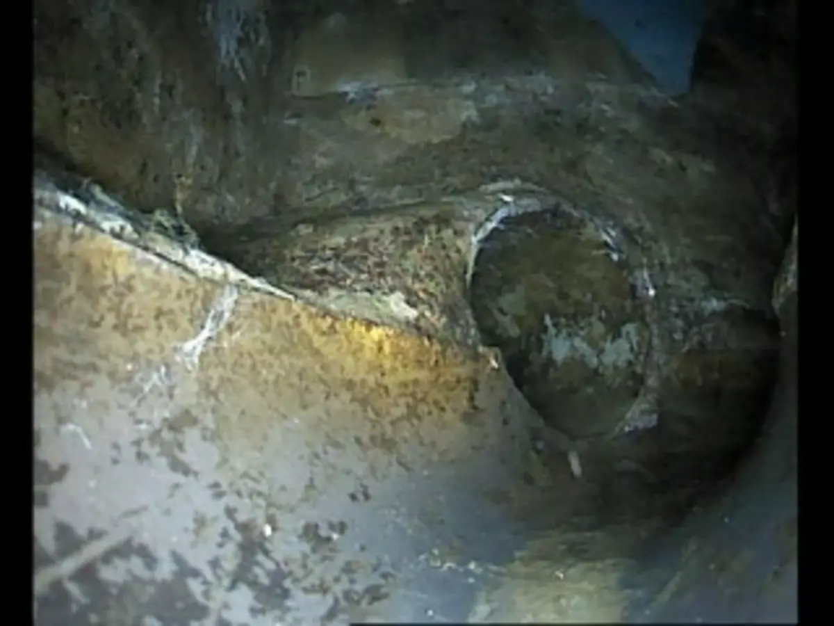 Professional CCTV view of a drainage pipe junction